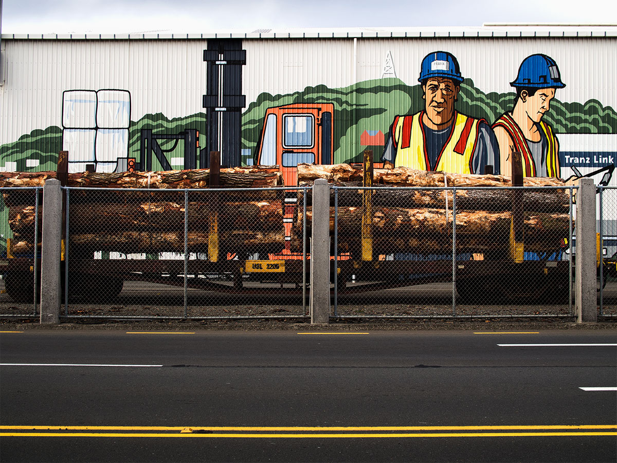 Artwork at the Wellington port with pieces of wood, trains and a fence New Zealand